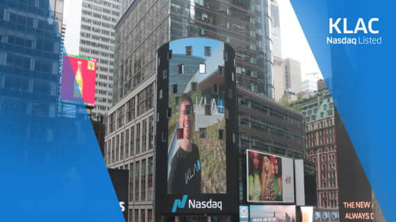 Picture of KLA employee on building-facade in New York City during the KLA Nasdaq launch